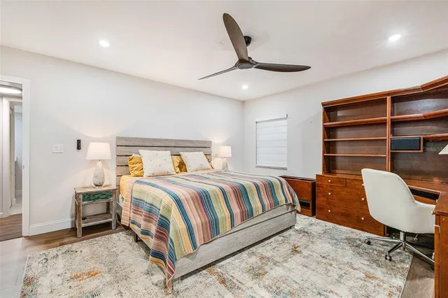 a bedroom with a large bed and furniture