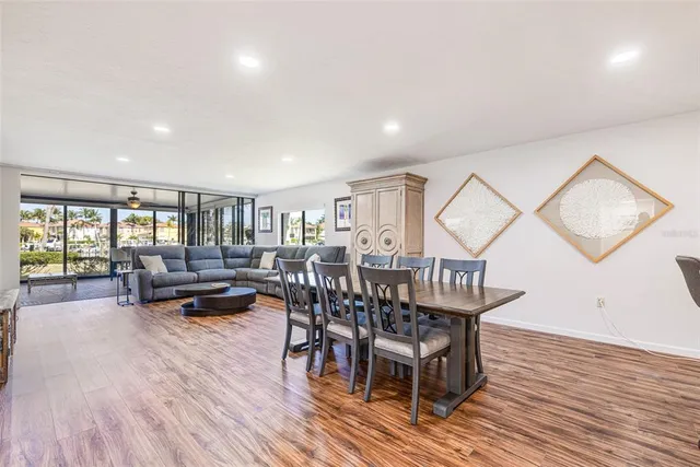 a view of a dining room with furniture window and wooden floor