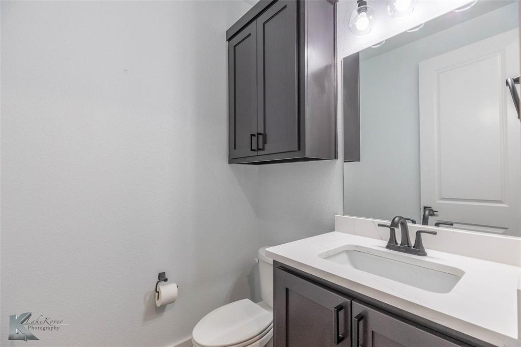 3325 Ace Abilene, TX 79606 - Photo 20 of 40 a bathroom with a sink and a toilet