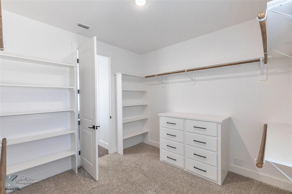3325 Ace Abilene, TX 79606 - Photo 29 of 40 a view of walk in closet with empty racks