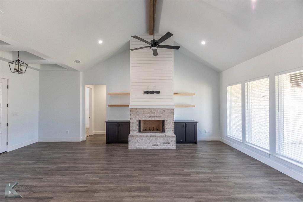 3325 Ace Abilene, TX 79606 - Photo 8 of 40 a view of a livingroom with a fireplace and window