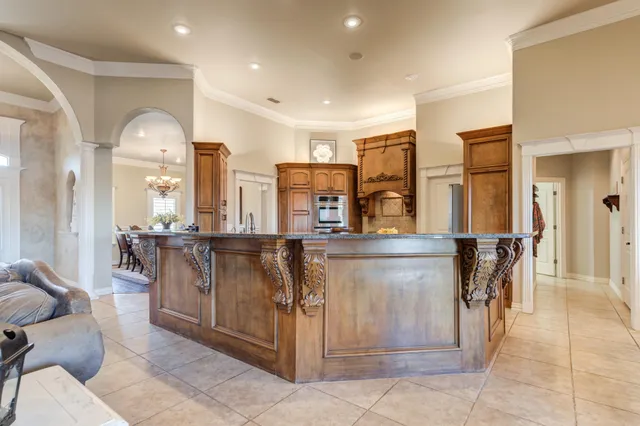 a bathroom with a granite countertop sink and a stove