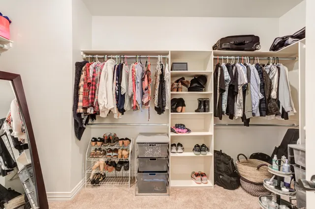 a view of a livingroom with workspace and a window