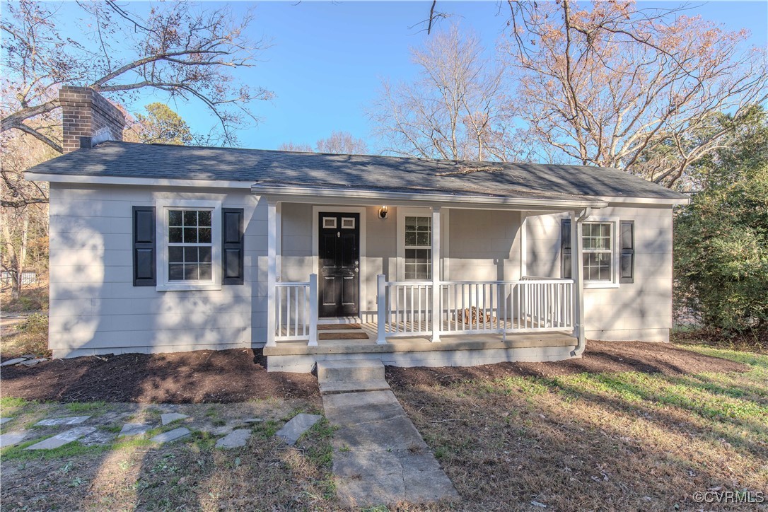 Ranch-style home featuring a porch