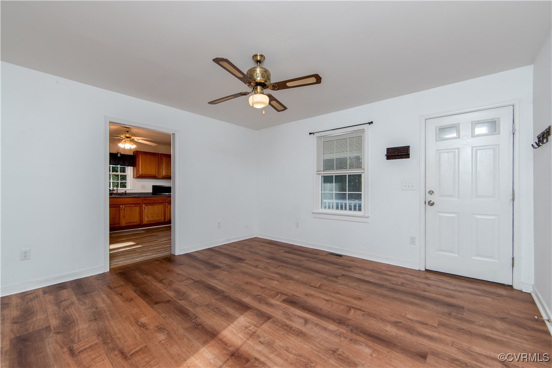 2015 Hicks Road Richmond, VA 23235 - Photo 14 of 31 Unfurnished living room with ceiling fan, dark woo