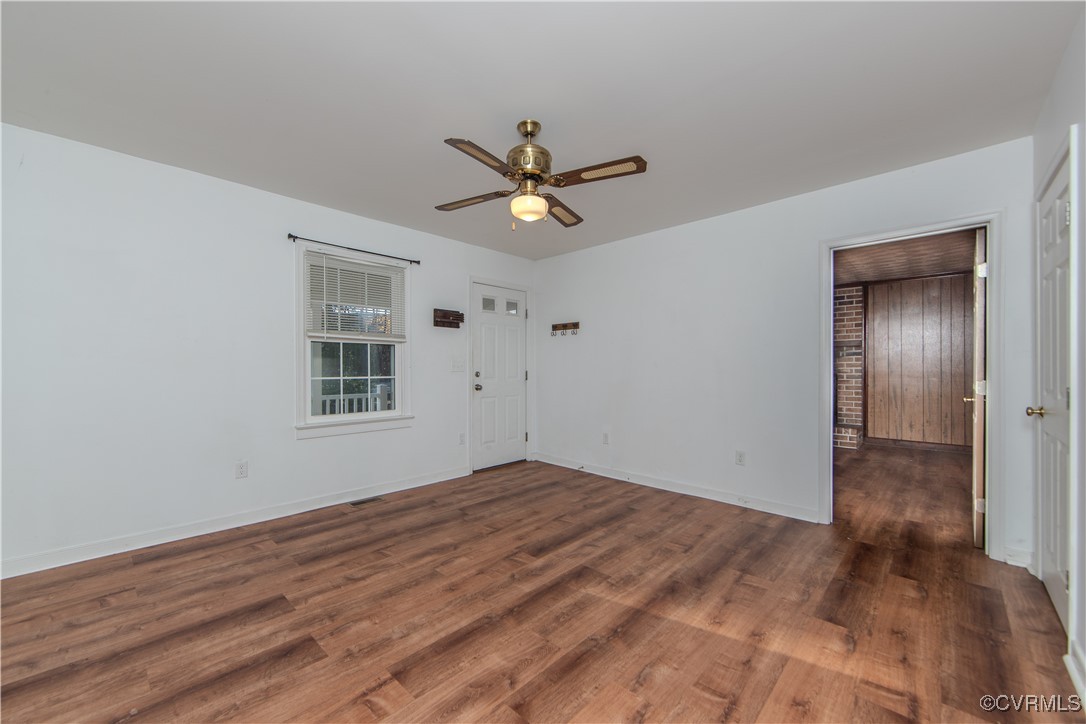 2015 Hicks Road Richmond, VA 23235 - Photo 15 of 31 Empty room with ceiling fan and dark wood-type flo