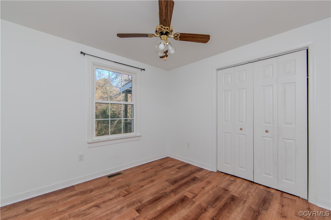 2015 Hicks Road Richmond, VA 23235 - Photo 18 of 31 Unfurnished bedroom with hardwood / wood-style flo