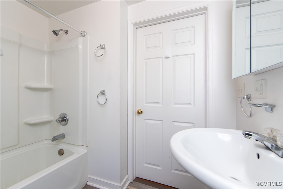 2015 Hicks Road Richmond, VA 23235 - Photo 20 of 31 Bathroom with sink, hardwood / wood-style floors,