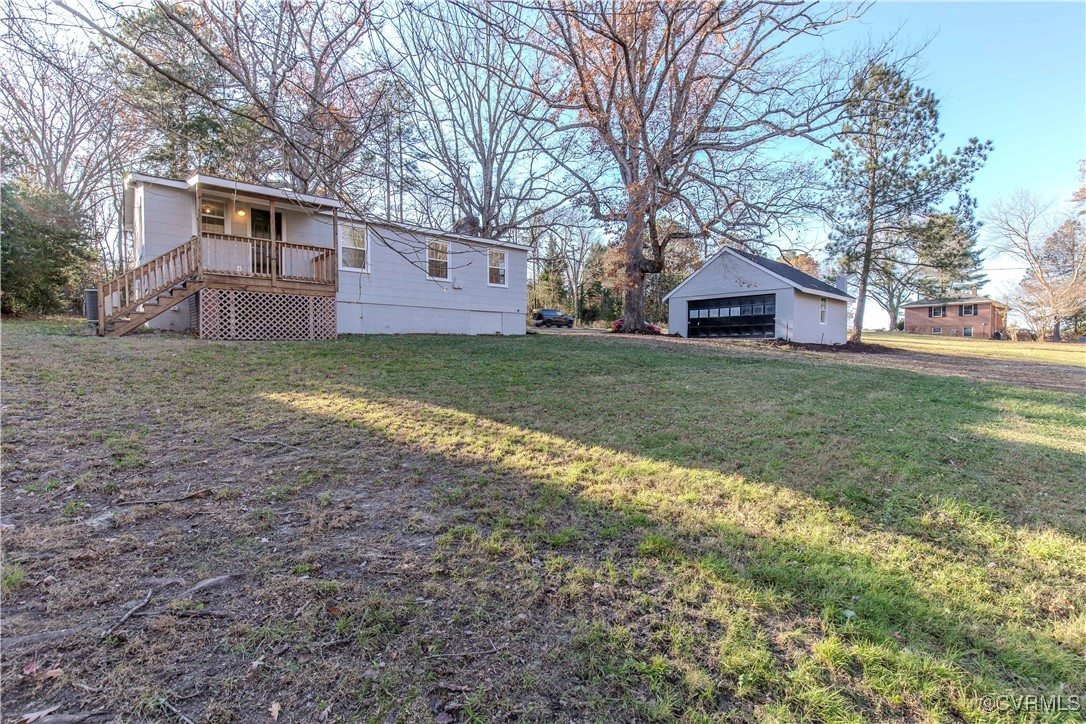 2015 Hicks Road Richmond, VA 23235 - Photo 30 of 31 View of yard featuring a garage, an outdoor struct