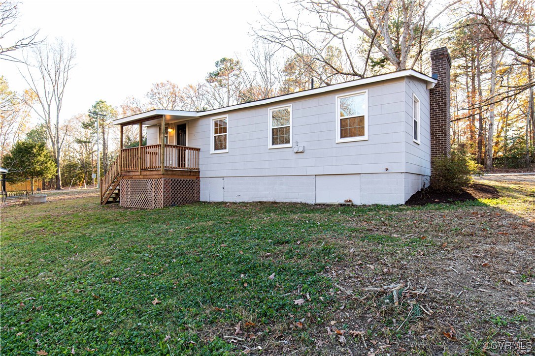 2015 Hicks Road Richmond, VA 23235 - Photo 31 of 31 Rear view of house with a lawn
