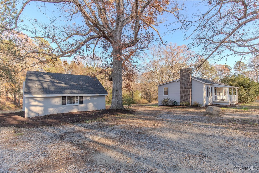 2015 Hicks Road Richmond, VA 23235 - Photo 6 of 31 View of side of home featuring covered porch