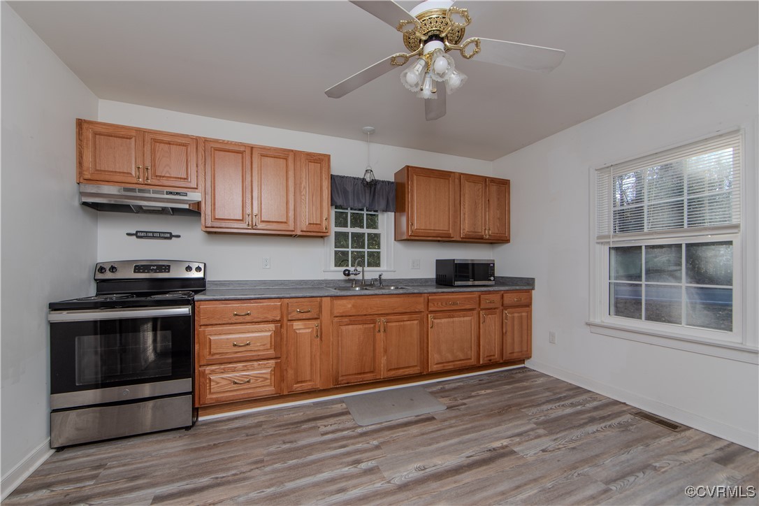 2015 Hicks Road Richmond, VA 23235 - Photo 10 of 31 Kitchen featuring ceiling fan, light wood-type flo