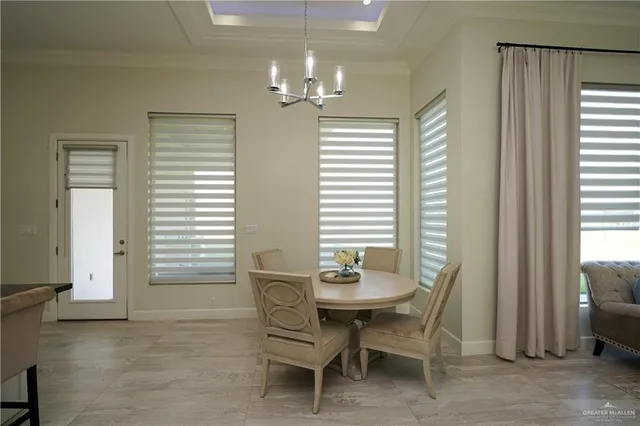 a dining room with furniture and window