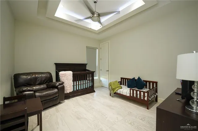 a bedroom with furniture and a window