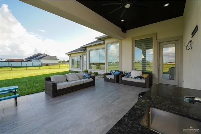 a living room with furniture and garden