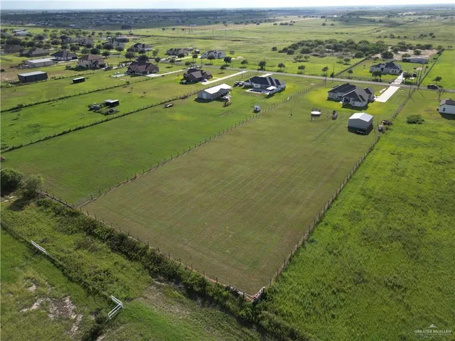 a view of a lake with a yard