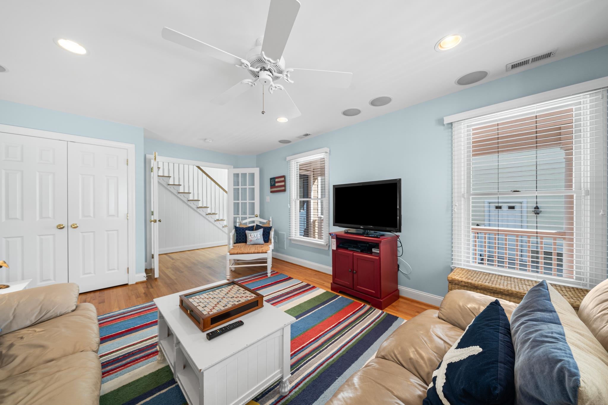 55 West 29th Avalon, NJ 08202 - Photo 15 of 32 a living room with furniture and a flat screen tv