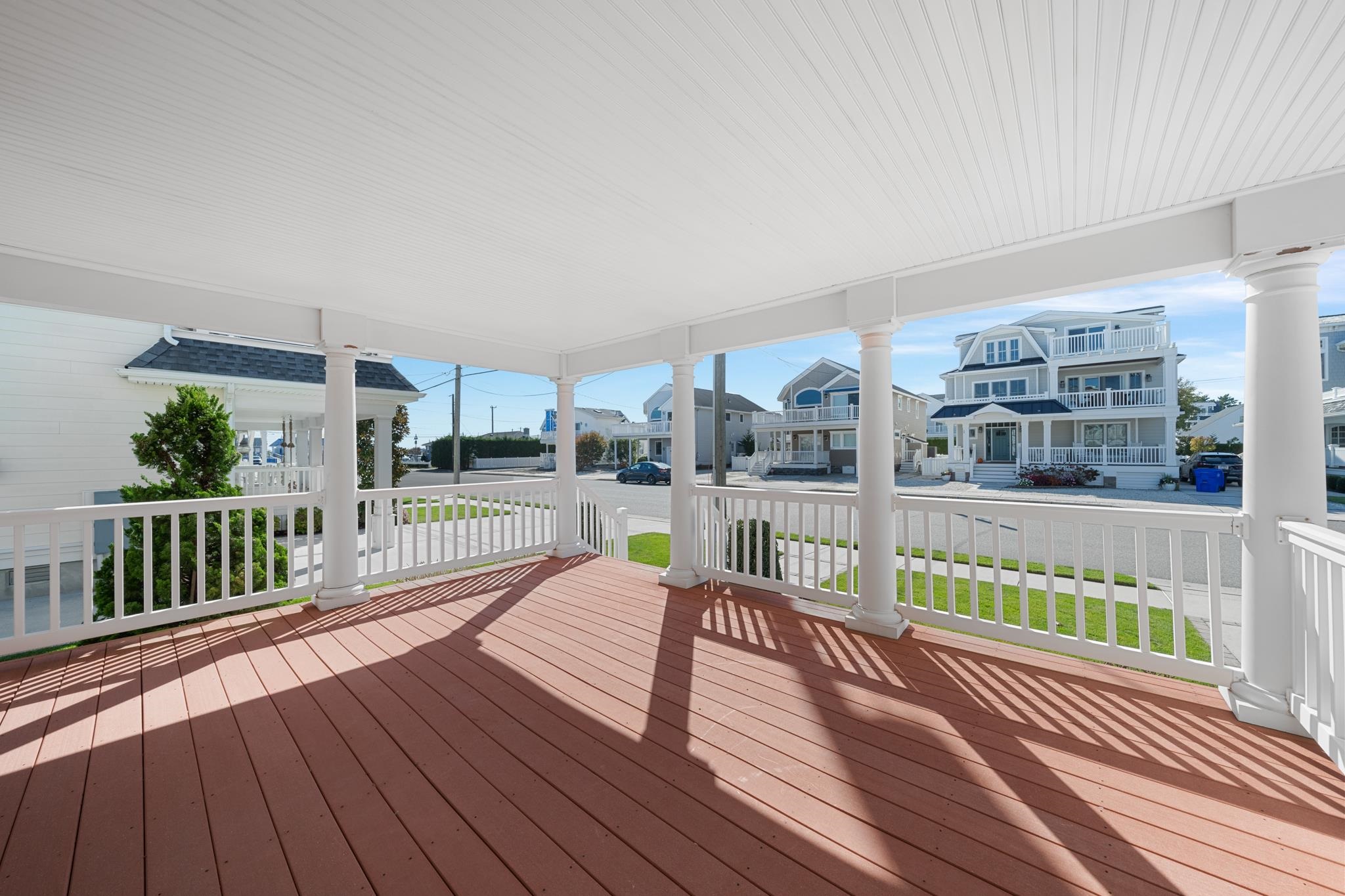 55 West 29th Avalon, NJ 08202 - Photo 18 of 32 a view of a balcony with wooden floor