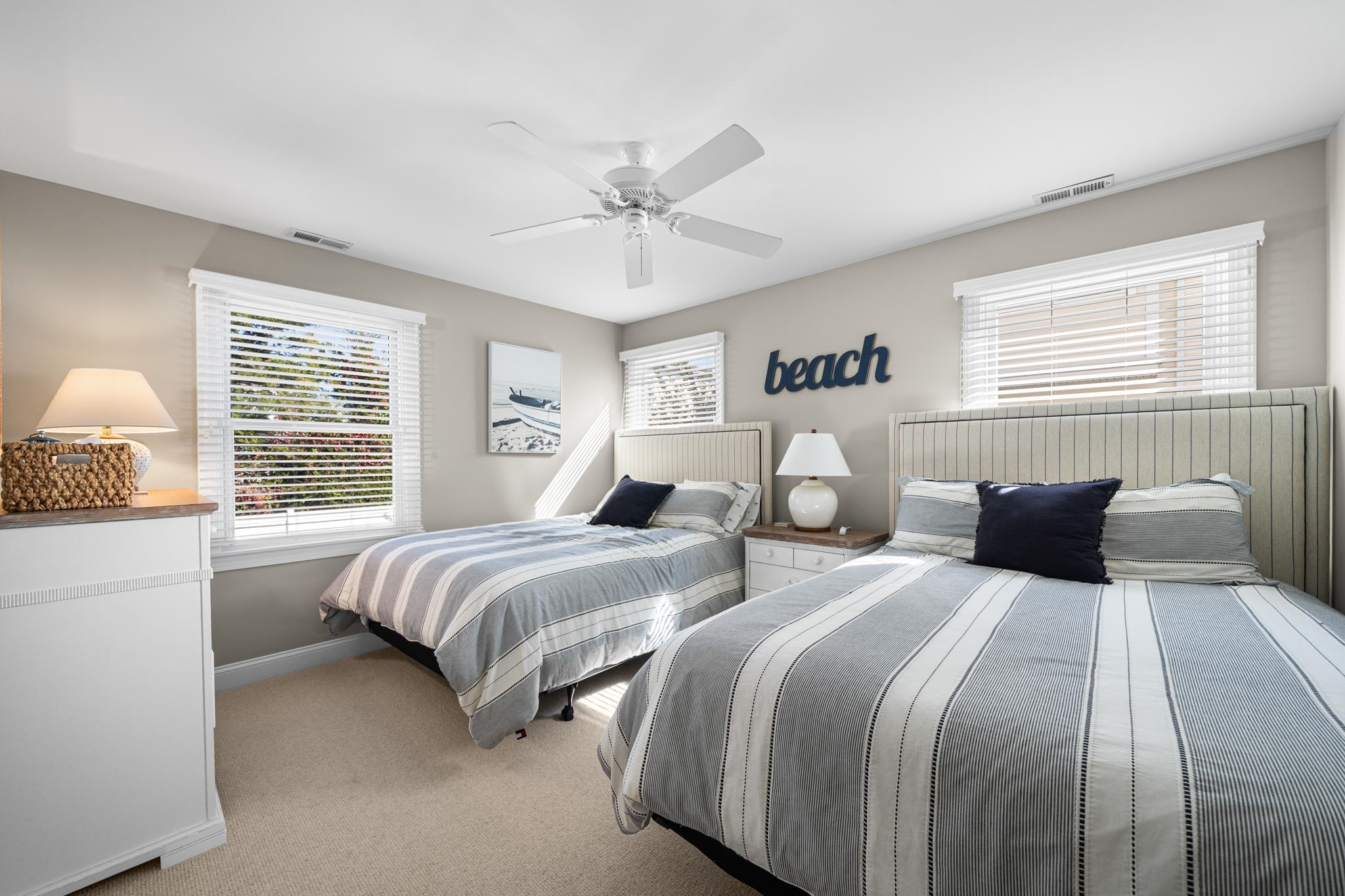 55 West 29th Avalon, NJ 08202 - Photo 21 of 32 a bedroom with two beds and a window
