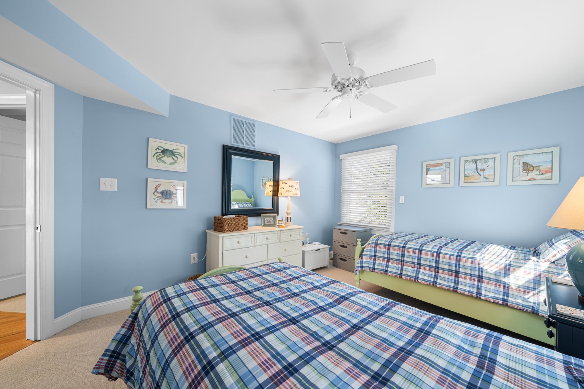 55 West 29th Avalon, NJ 08202 - Photo 25 of 32 a bedroom with a bed and wooden floor