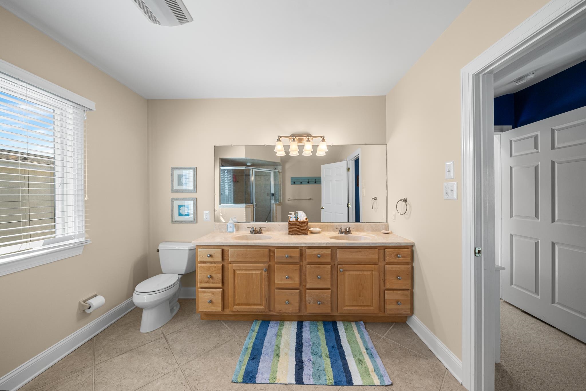 55 West 29th Avalon, NJ 08202 - Photo 29 of 32 a large bathroom with a sink mirror and window