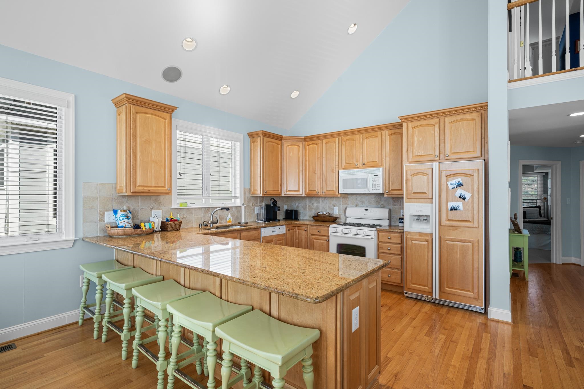 55 West 29th Avalon, NJ 08202 - Photo 10 of 32 a kitchen with stainless steel appliances granite countertop a stove and a refrigerator