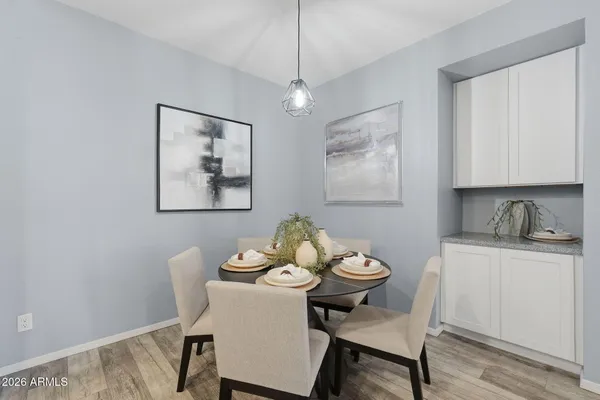 a view of a dining room with furniture and wooden floor