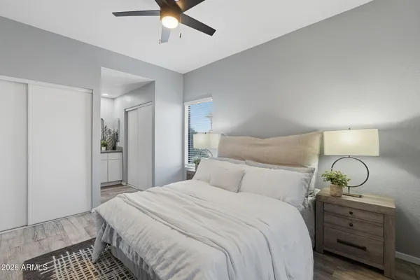 a bedroom with a bed and window