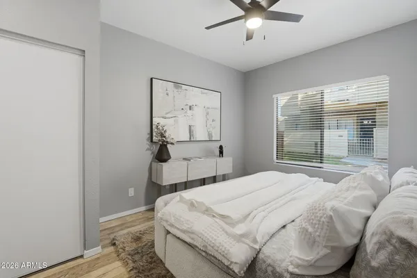 a bedroom with a bed and window