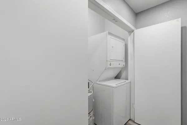 a utility room with a sink dryer and washer