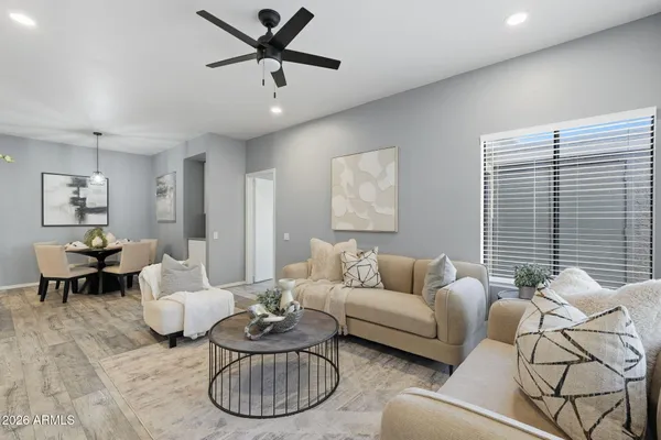 a living room with furniture and a large window