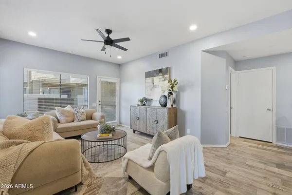a living room with furniture and a large window