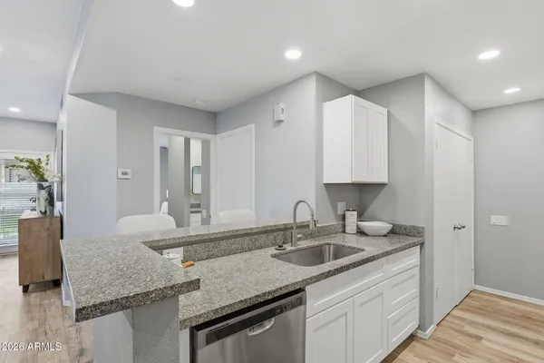 a kitchen with sink cabinets and stove