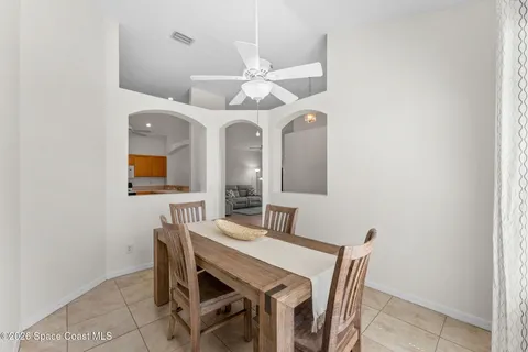 a dining room with a table and chairs