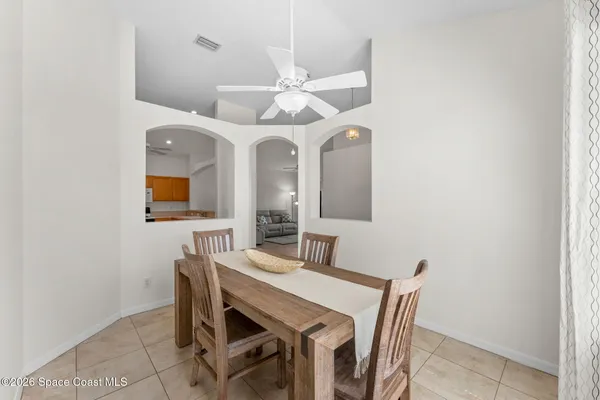 a dining room with a table and chairs
