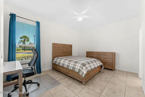 a bedroom with a bed and a table in it