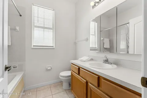 a bathroom with a sink toilet and vanity