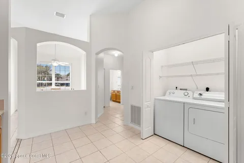 a view of utility room with closet