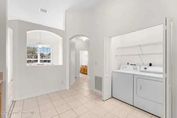 a view of utility room with closet