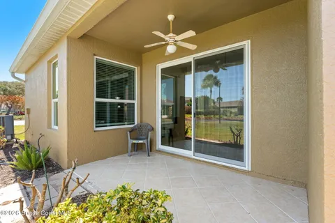 a view of an entryway with a flower garden