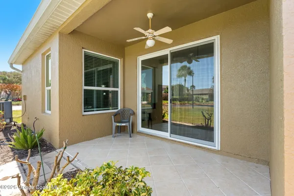 a view of an entryway with a flower garden