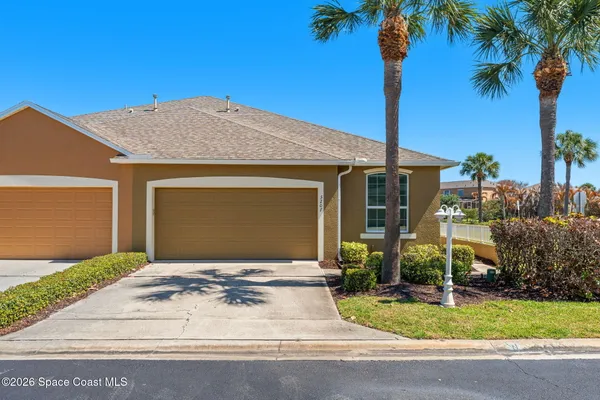 a front view of a house with yard