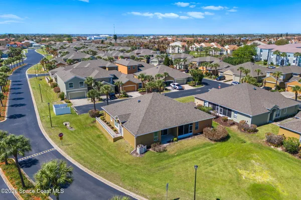 an aerial view of a house with a swimming pool