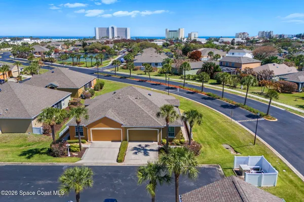 an aerial view of a house with a swimming pool yard and lake view