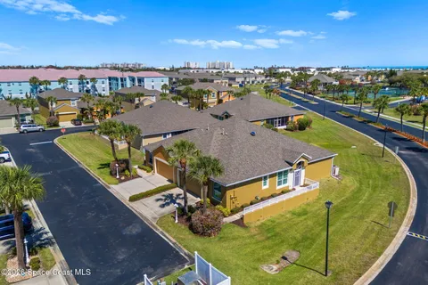an aerial view of a house with a swimming pool