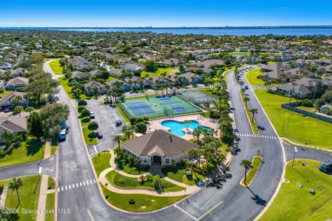an aerial view of a house with a swimming pool
