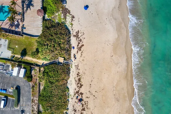 a view of a house with swimming pool and sitting area