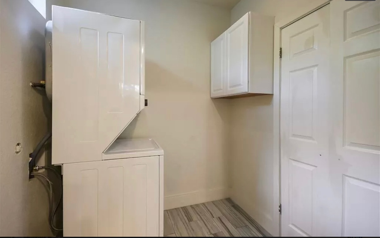 1007 Reagan Terrace Austin, TX 78704 - Photo 12 of 20 Laundry area with stacked washer and clothes dryer