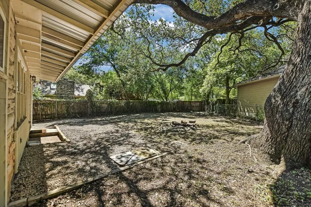 a backyard of a house with lots of green space