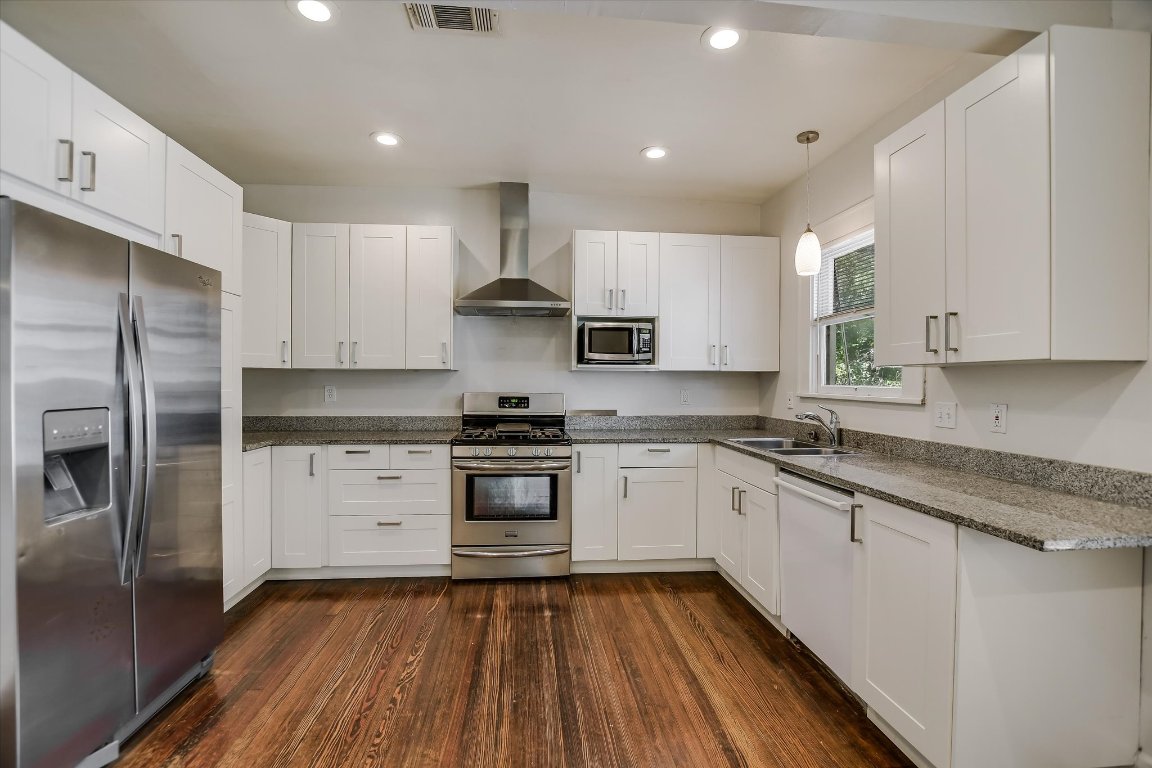 1007 Reagan Terrace Austin, TX 78704 - Photo 8 of 20 Kitchen featuring appliances with stainless steel finishes.